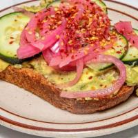 Avocado Smash Toast · Cucumbers, pickled onions, goat cheese, and chili flakes.