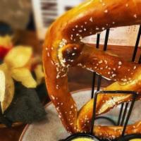 Giant East Meadow Soft Pretzel · Locally hand made pretzel, sea salt, ale cheese dip, stout mustard