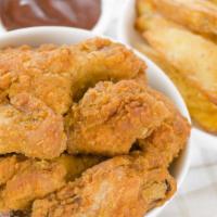 Classic Chicken Wings · Crispy chicken wings deep-fried and breaded to a perfect crisp.