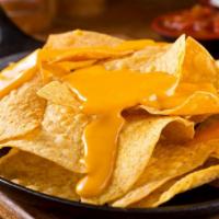 Nachos · Delicious tortilla chips topped with melted cheese and additional savory toppings.