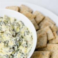 Spinach And Artichoke Dip · Delicious dip made from a mix of cream cheese, sour cream, cooked spinach, marinated articho...