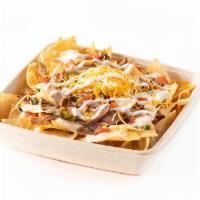 Nachos · A pile of our wildly addictive, seasoned chips topped with your choice of fresh toppings, ho...