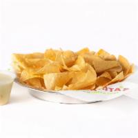 Chips & Queso · Individual portion of our wildly addictive chips & creamy queso..
