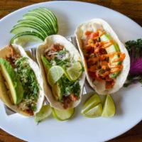 Coconut Shrimp Tacos (3) · Breaded coconut jumbo shrimp topped with avocado, mango salsa, cilantro, and fresh lime, ser...