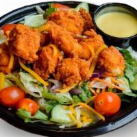Spicy Pdq Salad · Spicy Chicken, mixed greens, red cabbage, carrots, cheddar & jack cheeses, tomatoes, cucumbe...