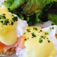 Poached Eggs With Gravlox Salmon · Gravlox salmon on an English muffin with Hollandaise sauce. Served with field greens.
