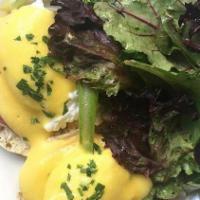 Eggs Benedict · Bacon on an English muffin topped with Hollandaise sauce. Served with field greens.