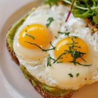 Eggs On Toast  · Whole grain toast with mashed avocado and eggs. Served with a side of salad.