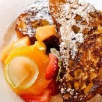 French Toast · Served with fresh fruit and maple syrup.