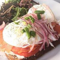 Eggs On Toast  With Cream Cheese & Salmon · Whole grain toast with poached eggs, cream cheese, gravlox salmon, tomato, red onions, and c...