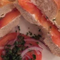 Toast Bagel With Salmon · withe cream cheese tomato capers and red onions