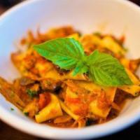 Pappardelle · Served with shiitake, oysters, crimini mushrooms, duck and confit ragout finished with truff...