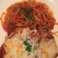 Chicken Parmigiana  · Pounded and breaded chicken breast with tomato sauce, mozzarella and a side of spaghetti.