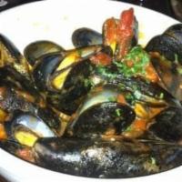 Steamed Mussels With White Wine · White wine, onions and parsley.