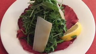 Bresaola With Arugula Salad · Shaved Parmigiano cheese, lemon and olive oil.
