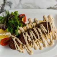 Falafel · Small croquettes of mashed chickpeas, garlic, and greens served with hummus