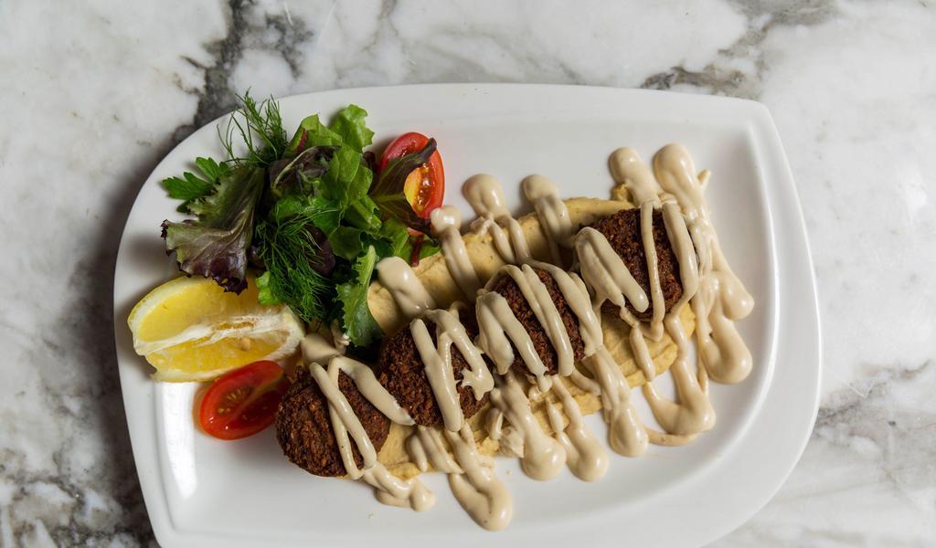 Falafel · Small croquettes of mashed chickpeas, garlic, and greens served with hummus