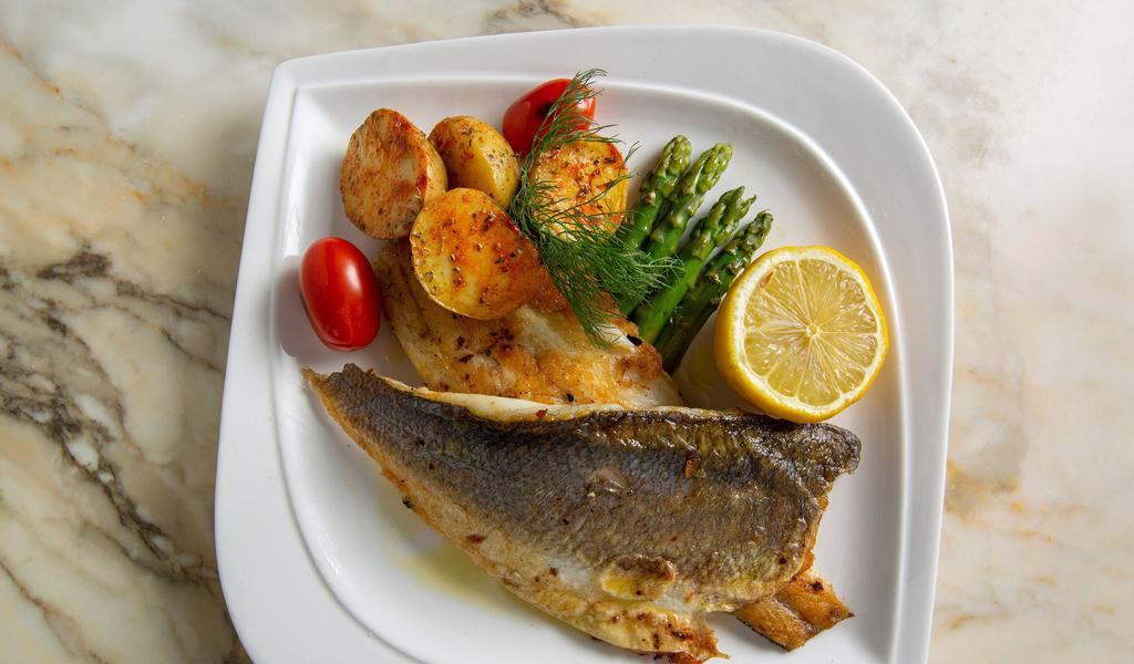 Sea Bass · Served with roasted potatoes and asparagus.