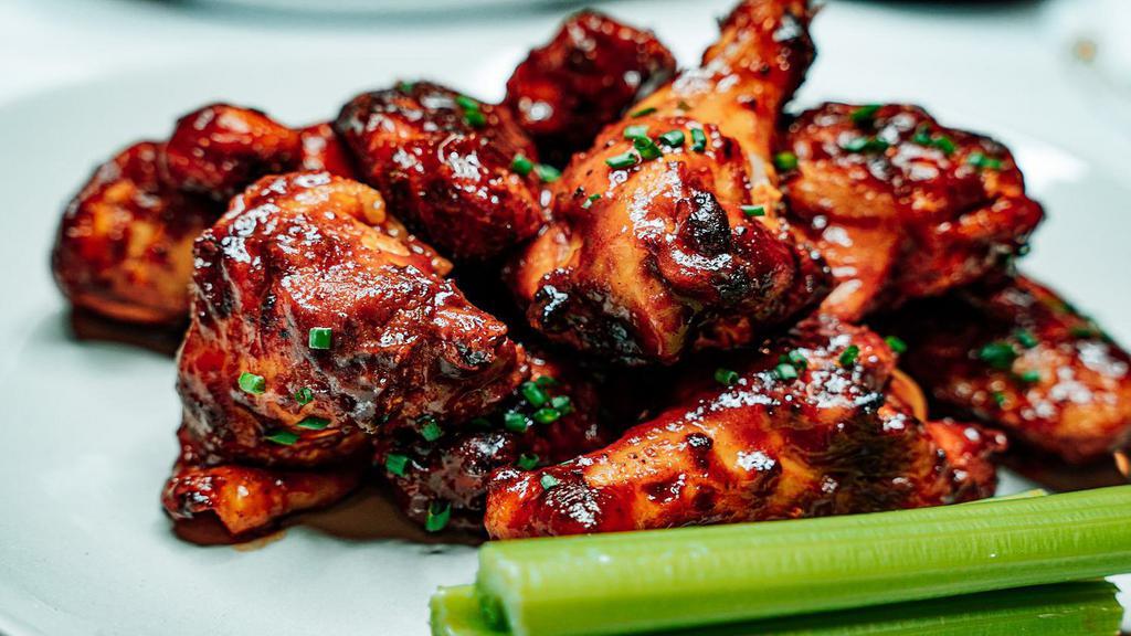 Wings · Cooked wings of a chicken coated in sauce or seasoning.