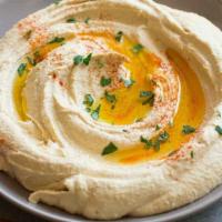 Homemade Hummus · Homemade hummus made fresh daily. Comes with toasted pita bread.