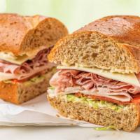 Wegmans Assorted · Thinly sliced turkey, ham, and roast beef, with American cheese, shredded lettuce, tomato, a...