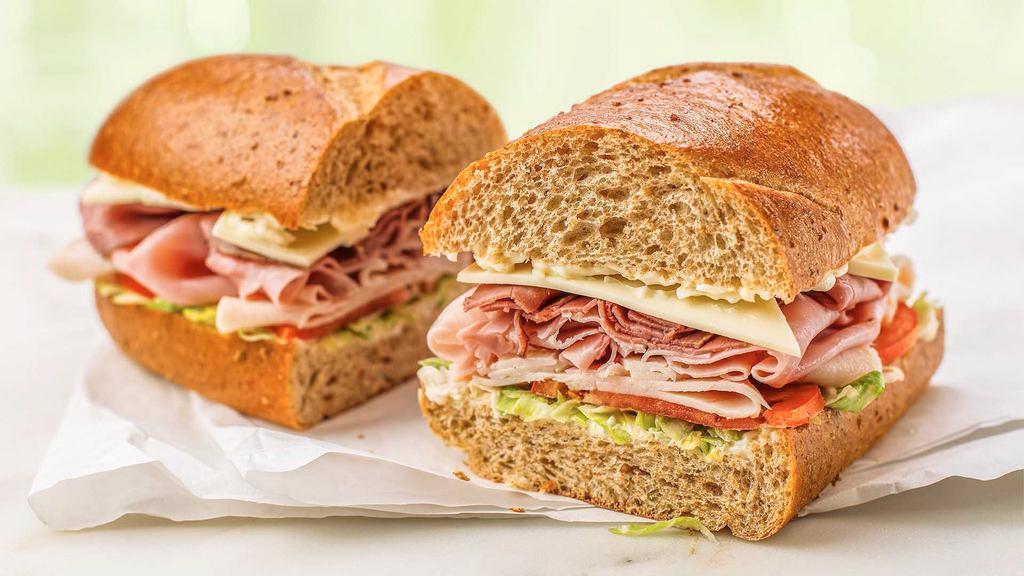 Wegmans Assorted · Thinly sliced turkey, ham, and roast beef, with American cheese, shredded lettuce, tomato, and mayo on our wheat sub roll.