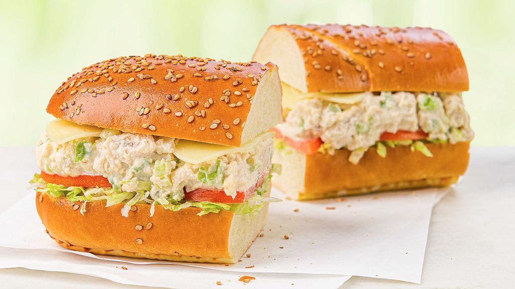 Chicken Salad Sub · Our signature chicken salad with fresh shredded lettuce, tomatoes, and provolone cheese on a white seeded sub roll.