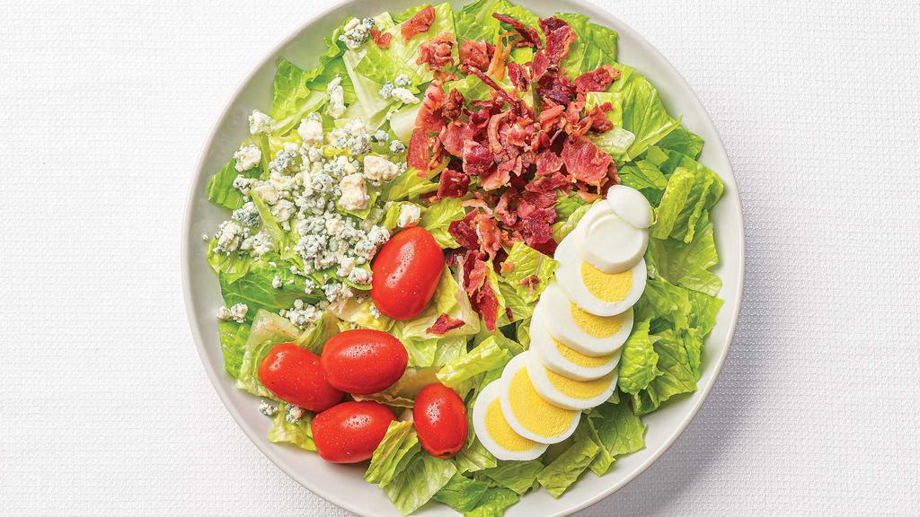 Large Cobb Salad With Chicken · Fresh romaine with grilled lemon garlic chicken breast, grape tomatoes, hardboiled eggs, crumbled Blue Cheese, bacon bits, and Blue Cheese Dressing.