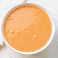 Lobster Bisque Soup · Minced sweet lobster meat simmered in cream and sherry create a rich and creamy lobster bisq...