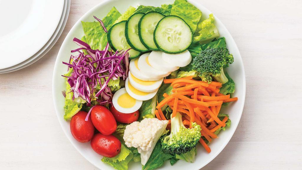 Regular Garden Salad · Fresh romaine with Broccoli, matchstick carrots, cucumber, grape tomatoes, hardboiled eggs, red cabbage, and Buttermilk Ranch Dressing.