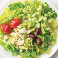 Regular Greek Santorini Salad · Fresh romaine with seedless cucumbers, kalamata olives, grape tomatoes, feta cheese, and Gre...