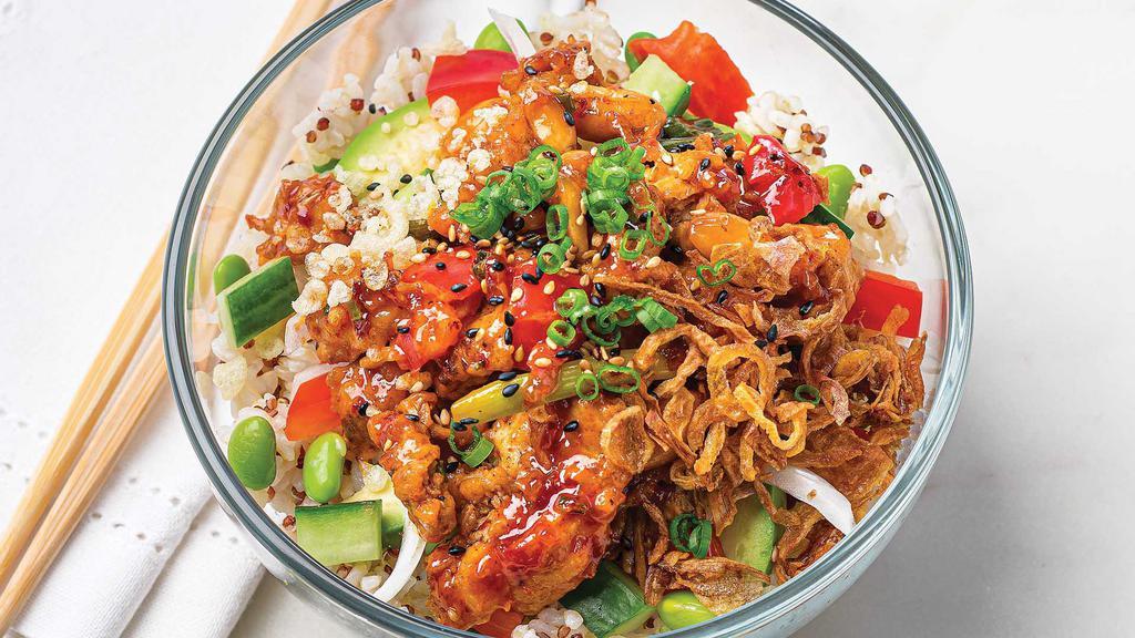 Kung Pao Chicken Poke Bowl · Our signature Kung Pao Chicken, avocado, and fresh veggies with sweet & spicy poke sauce, tempura crispies, crispy shallots, scallions, sesame seeds, and roasted peanuts on a bed of quinoa brown rice. .