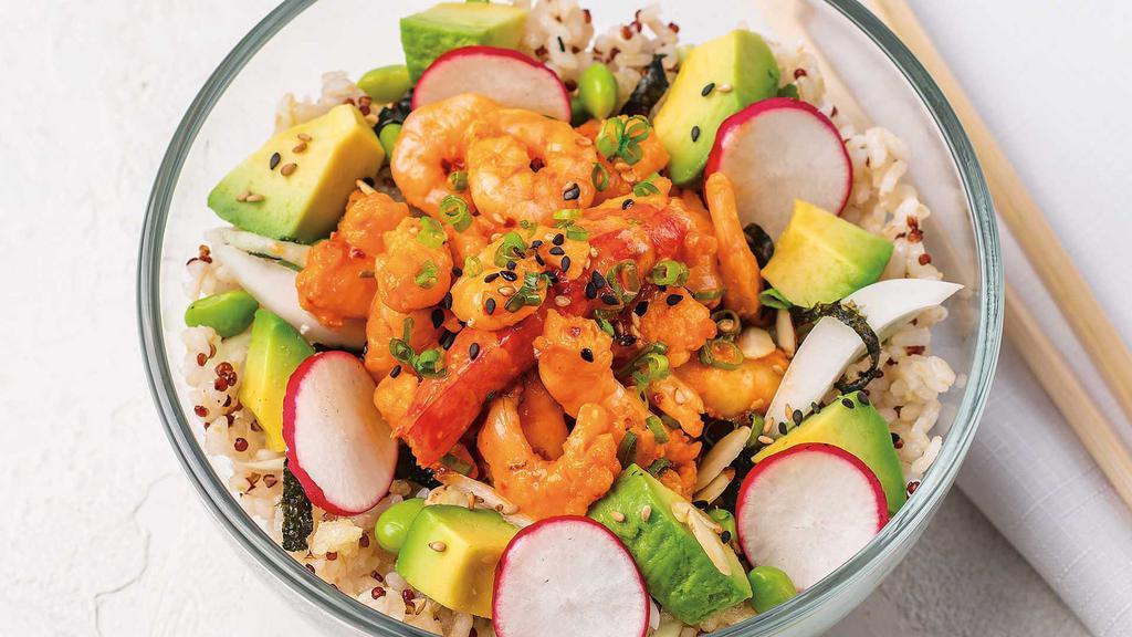 Sweet & Spicy Firecracker Shrimp Poke Salad · Cooked shrimp, avocado, and fresh veggies topped with a sweet & spicy sauce, toasted almonds, tempura crispies, scallions, and sesame seeds on a zucchini noodles & arugula mix.