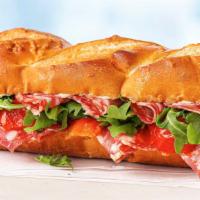 Salami On Baguette · Creamy, robust, flavorful salami, mayo, roasted tomatoes, and baby arugula on a soft America...