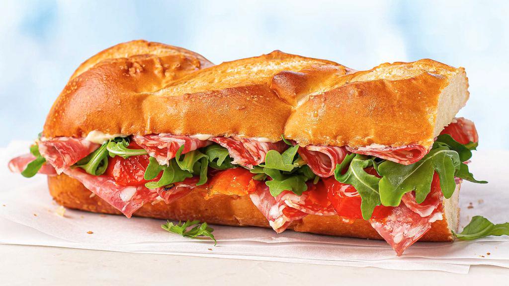 Salami On Baguette · Creamy, robust, flavorful salami, mayo, roasted tomatoes, and baby arugula on a soft American baguette.