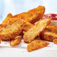 Potato Wedges · Skin-on, perfectly seasoned potato wedges. Served with ketchup.