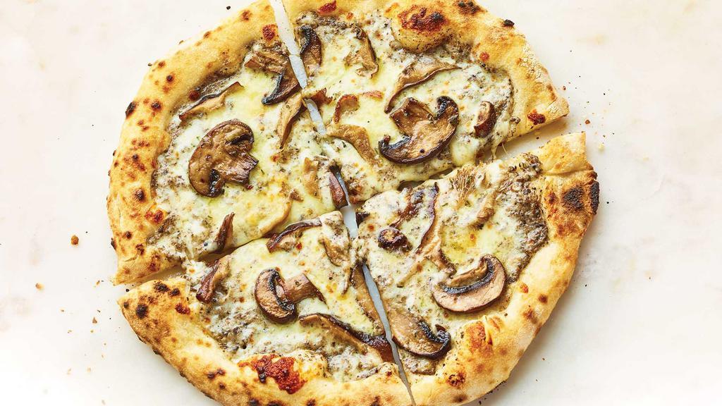 Mushrooms & Truffle Pizza · Rich, earthy truffle parmesan sauce topped with mozzarella and Fontina cheeses and roasted mushrooms. Hot & ready to enjoy!