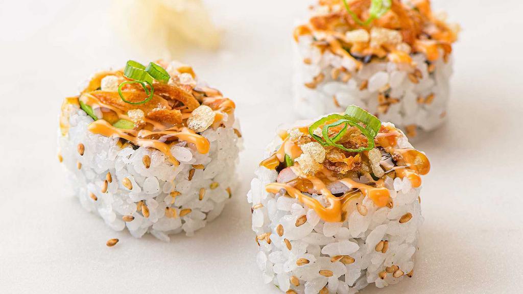 Crunchy California Roll · Our customer favorite California Roll (made with fresh avocado, cucumber and Kanikama), topped with spicy mayo, teriyaki sauce, tempura crispies and fried shallots. 8-pc.