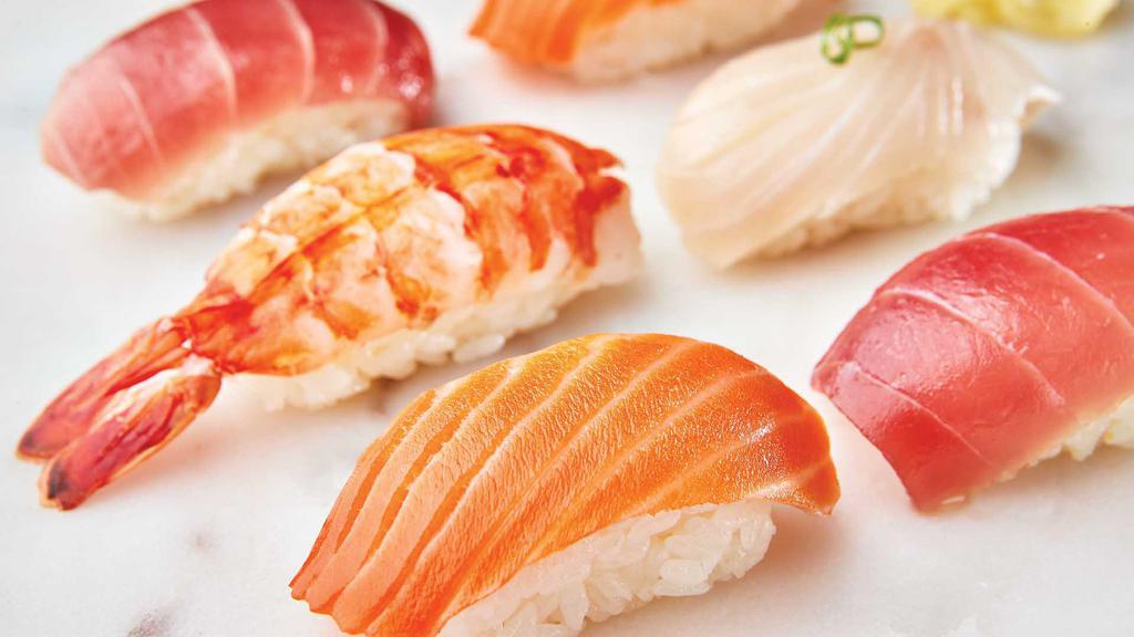 9-Pc Nigiri · Delicate sushi rice topped with King Salmon (3-pc), Ahi Tuna (2-pc), Yellowtail (2-pc), and Shrimp (2-pc). Substitutions may occur based on availability.