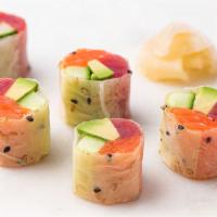 Rainbow Skinny Roll · Ahi tuna, buttery Alpine King Salmon, creamy avocado, and crisp cucumber wrapped in sesame s...