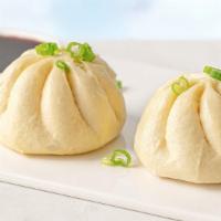 Spicy Pork Steamed Buns  - 2 Pack · Steamed buns filled with mouthwatering ground pork, fresh scallions, ginger, and garlic, ser...
