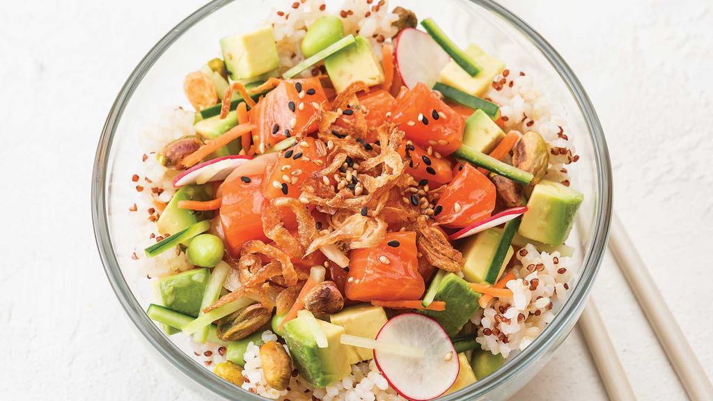 King Salmon Poke Bowl · Alpine Salmon, poke sauce, avocado, and fresh veggies topped with crunchy pistachios and toasted sesame seeds, on a bed of quinoa brown rice.