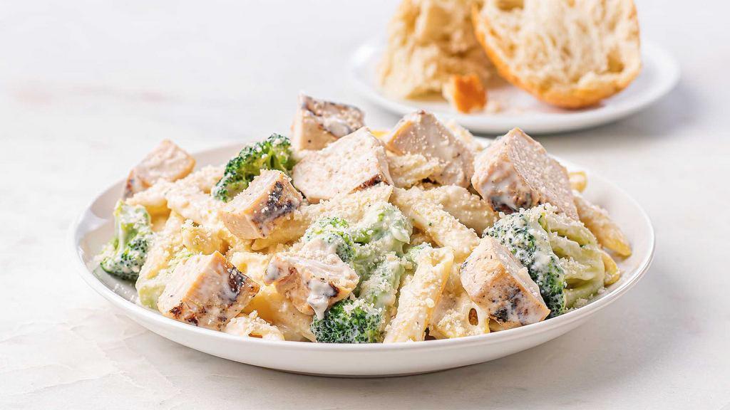 Penne Alfredo With Chicken & Broccoli · Ready to heat, our penne pasta is tossed in creamy Alfredo sauce and broccoli, then topped with juicy grilled chicken breast, grated Parmigiano Reggiano, and imported extra virgin olive oil.