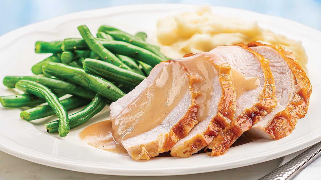 Roasted Turkey Meal · Ready to heat, our juicy oven-roasted turkey slices are paired with flavorful homestyle gravy, signature whipped potatoes, and seasoned green beans. Turkey is raised without antibiotics.