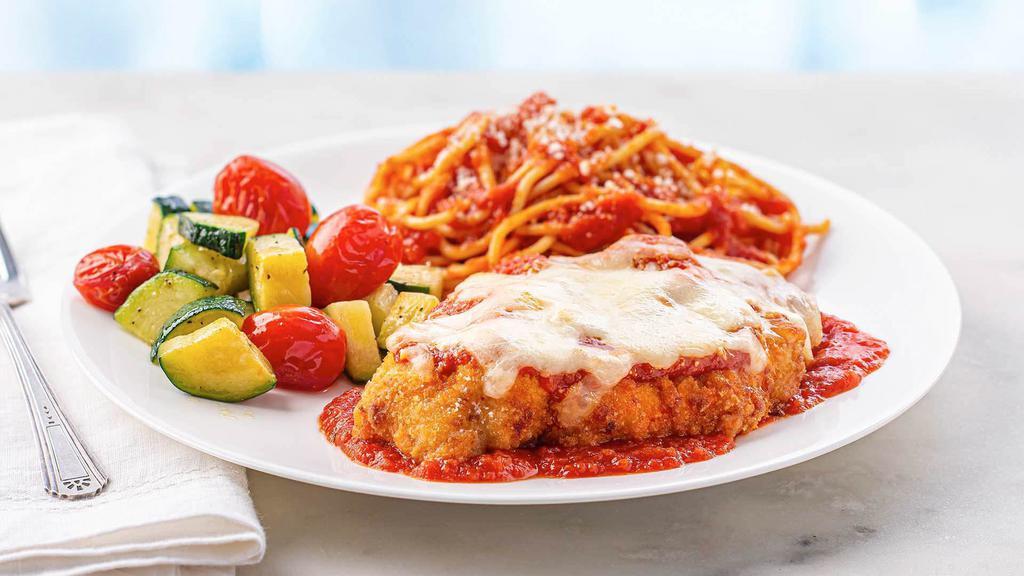 Chicken Parmesan Meal · Ready to heat, our juicy breaded chicken breast raised without antibiotics is topped with Italian cheese and seasoned tomato sauce and served with al dente spaghetti and seasoned green beans.