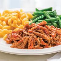 Bbq Pulled Pork Meal · Ready to heat, our tender pulled pork is topped with BBQ sauce and served with seasoned gree...