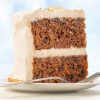 Ultimate Carrot Cake Slice · Incredibly moist cake with carrots, walnuts, and golden raisins, finished with cream cheese ...