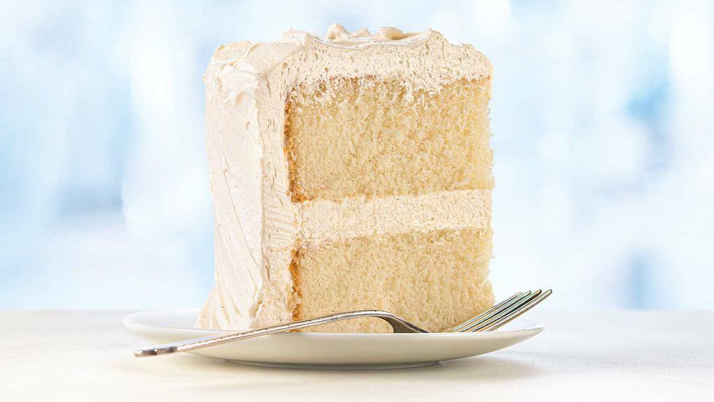 Ultimate White Cake Slice · A very moist, slightly dense 2-layer white cake iced with a premium vanilla buttercream..