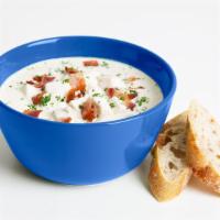 New England Clam Chowder · Classic New England clam chowder with a side of toast.