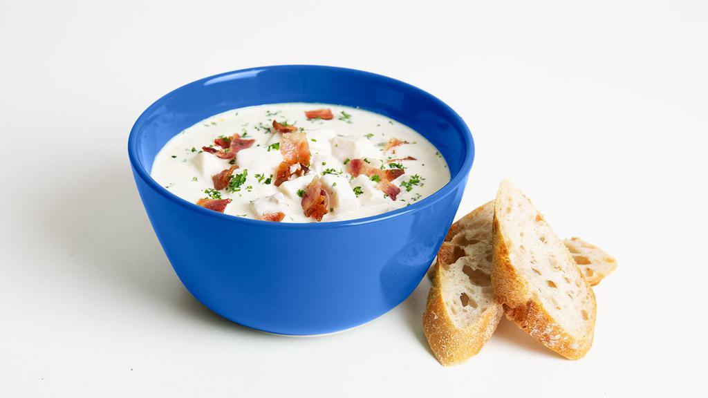 New England Clam Chowder · Classic New England clam chowder with a side of toast.